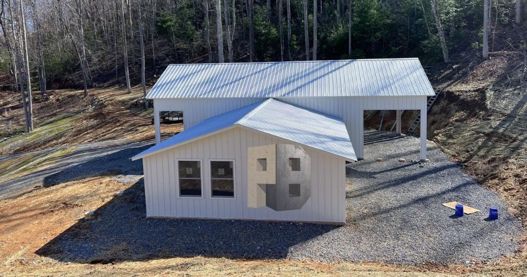 Metal building with white siding and durable roof in Mount Airy, NC